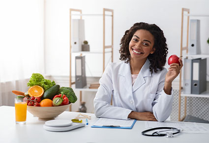 woman dietitian holding an apple