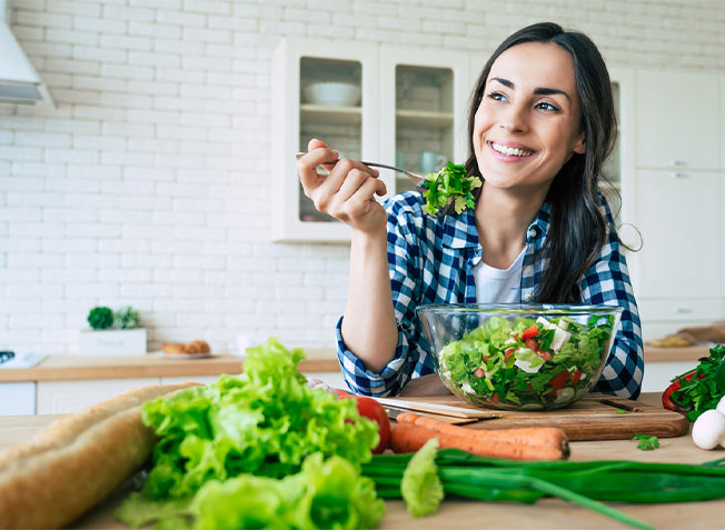 woman eating salad