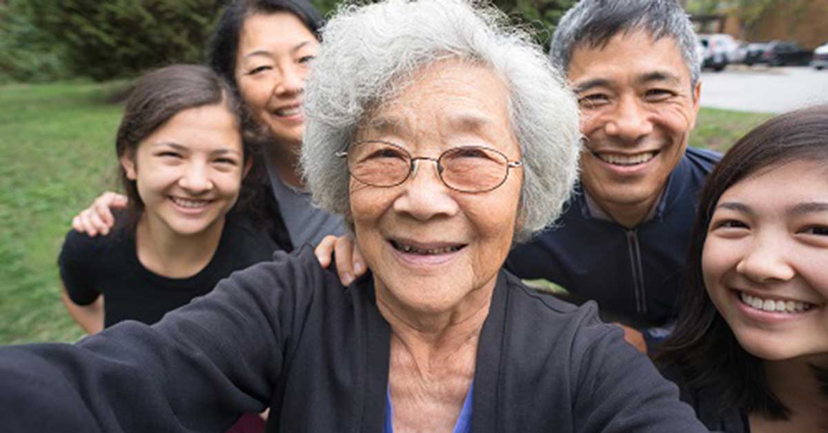 5 generation Asian family taking selfie