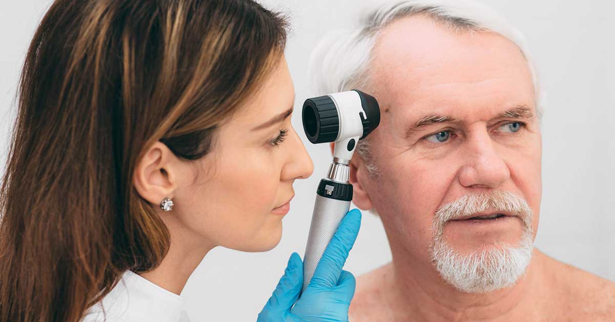 Dermatologist Inspecting patient skin moles at clinic