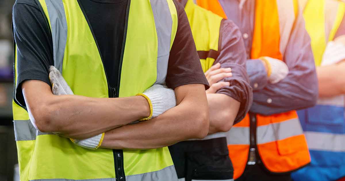 Construction workers with arms crossed