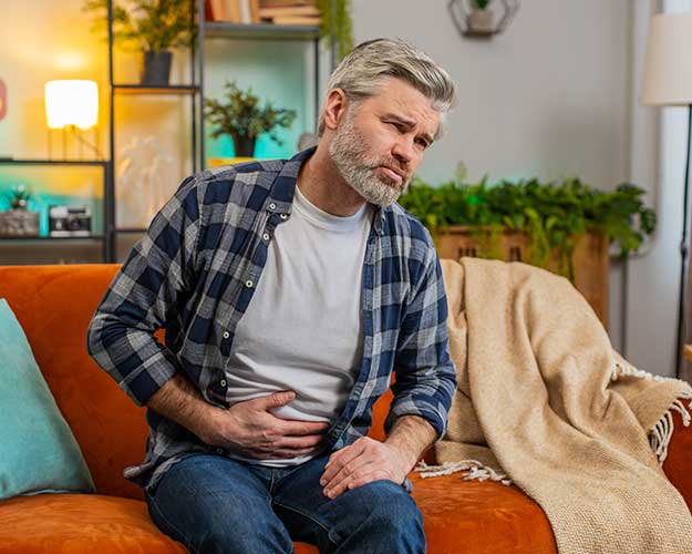 Mature man with stomach pain