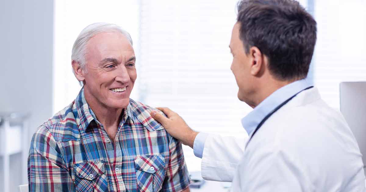 Senior man speaking to doctor