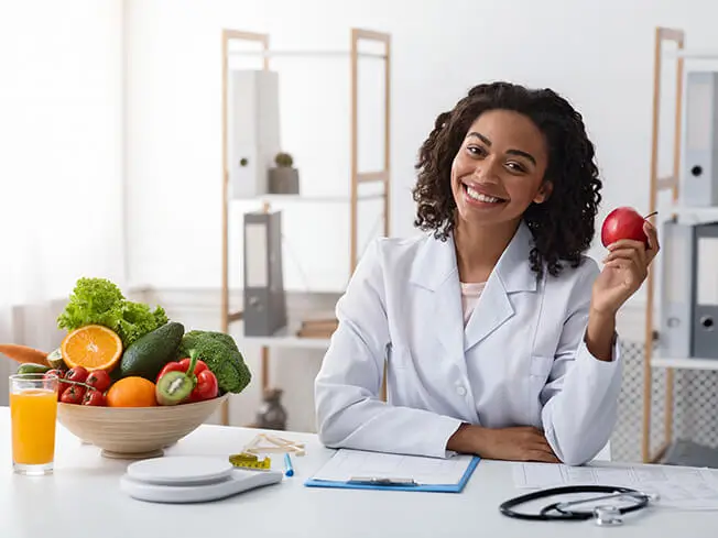 woman dietitian holding an apple